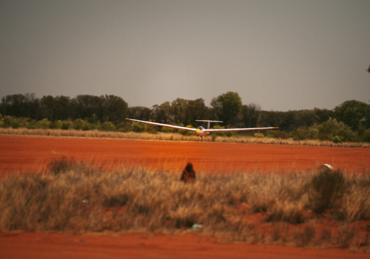 A glider lands after a scenic flight. Take to the skies with the Alice Springs Gliding Club on a silent flight above Central Australia.
